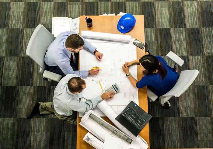 developers at the meeting reviewing site plans